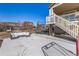 This backyard features a trampoline, an outdoor sofa, and a second story deck at 15310 E 108Th Way, Commerce City, CO 80022