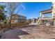 Backyard with stamped concrete patio, spacious upper deck, and fenced yard at 15310 E 108Th Way, Commerce City, CO 80022