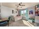 Bright bedroom featuring a ceiling fan, a large window for natural light, a built-in bed, and a playful decor at 15310 E 108Th Way, Commerce City, CO 80022