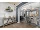 Elegant dining area featuring stylish decor, a modern light fixture, and hardwood floors at 15310 E 108Th Way, Commerce City, CO 80022