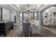 Charming dining room featuring modern light fixtures, hardwood floors, and stylish furniture at 15310 E 108Th Way, Commerce City, CO 80022