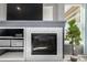 Close up of a stylish fireplace and a lush indoor plant at 15310 E 108Th Way, Commerce City, CO 80022