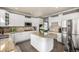 Charming kitchen with granite countertops, stainless steel appliances, and large island at 15310 E 108Th Way, Commerce City, CO 80022