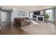 Spacious living room features a comfortable couch, fireplace, and natural light at 15310 E 108Th Way, Commerce City, CO 80022