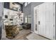 Bright and stylish living room with a chandelier, built-in shelving, and comfortable seating at 15310 E 108Th Way, Commerce City, CO 80022