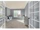 Bright office space with neutral walls, ample shelving, and French doors at 15310 E 108Th Way, Commerce City, CO 80022