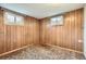 Basement with wood paneling, carpet, and two windows that provide natural light at 4534 W 65Th Ave, Arvada, CO 80003