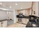 Kitchen featuring stainless steel appliances, granite countertops, and wood flooring at 4534 W 65Th Ave, Arvada, CO 80003