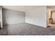 Spacious living room with gray carpet, neutral paint, and natural light at 4534 W 65Th Ave, Arvada, CO 80003