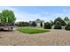 Spacious backyard with a lawn and stone landscaping at 1864 Malibu Ct, Fort Lupton, CO 80621