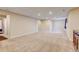 Large finished basement with neutral carpet, recessed lighting, and a doorway to a bathroom at 1864 Malibu Ct, Fort Lupton, CO 80621