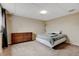Finished basement with neutral walls and carpet provides a calm and relaxing living area at 1864 Malibu Ct, Fort Lupton, CO 80621