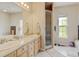 Bright bathroom featuring a double vanity, separate shower and soaking tub, and a window for natural light at 1864 Malibu Ct, Fort Lupton, CO 80621