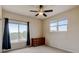 This bedroom includes large windows with an exterior view and plenty of space for storage at 1864 Malibu Ct, Fort Lupton, CO 80621
