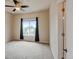 Bright and airy bedroom featuring a large window with natural light and neutral walls at 1864 Malibu Ct, Fort Lupton, CO 80621