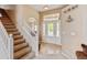 Inviting entryway with a staircase and decorative glass front door for great curb appeal at 1864 Malibu Ct, Fort Lupton, CO 80621