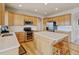 Spacious kitchen with a large island, stainless steel appliances, and light wood cabinetry at 1864 Malibu Ct, Fort Lupton, CO 80621