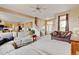 Open living room with kitchen access and lots of natural light at 1864 Malibu Ct, Fort Lupton, CO 80621
