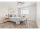 Cozy bedroom with neutral walls, carpeted floors, and large window seat at 1071 Oak Cir, Lakewood, CO 80215