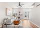 Bright living room features modern furnishings, hardwood floors and a contemporary ceiling fan at 1071 Oak Cir, Lakewood, CO 80215