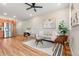 Comfortable living room featuring stylish decor, natural light, and a modern aesthetic perfect for relaxation and entertainment at 1071 Oak Cir, Lakewood, CO 80215