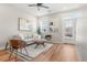 Bright living room with modern furniture and stylish decor, filled with natural light and access to outdoor space at 1071 Oak Cir, Lakewood, CO 80215