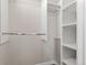 Walk-in closet with built-in shelving and hanging rods, offering ample storage space at 1071 Oak Cir, Lakewood, CO 80215