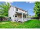 Spacious backyard features a large wooden deck, lush green lawn, and privacy fence at 5721 S Jellison St, Littleton, CO 80123