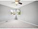 Well-lit bedroom with carpeted floors and two windows that allow natural light to fill the space at 5721 S Jellison St, Littleton, CO 80123