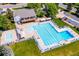 Aerial view of the community pool, clubhouse, and relaxing lounge chairs at 5721 S Jellison St, Littleton, CO 80123