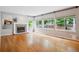 Bright living area with a fireplace and a view of the kitchen, creating an inviting living space at 5721 S Jellison St, Littleton, CO 80123