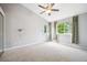 Bright, airy main bedroom with neutral walls, soft carpet and large windows overlooking backyard at 5721 S Jellison St, Littleton, CO 80123