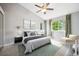 Spacious main bedroom with vaulted ceiling, neutral paint, and large windows for natural light at 5721 S Jellison St, Littleton, CO 80123