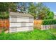 Outdoor storage shed in a well maintained yard with a beautiful lawn and privacy fence at 5721 S Jellison St, Littleton, CO 80123