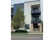 Stylish condo building exterior with balconies and attractive landscaping at 336 E 1St Ave # 310, Denver, CO 80203