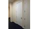 Hallway with a door and neutral walls at 336 E 1St Ave # 310, Denver, CO 80203