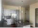Modern kitchen with stainless steel appliances, sleek countertops, and ample cabinet space at 336 E 1St Ave # 310, Denver, CO 80203