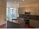 Modern kitchen featuring stainless steel appliances, an island with a sink, and lots of cabinet space at 336 E 1St Ave # 310, Denver, CO 80203