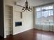 Bright living room featuring a fireplace, built-in shelving and an oversized window at 336 E 1St Ave # 310, Denver, CO 80203