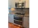 The stainless steel oven is built in, offering a contemporary design and space-saving efficiency at 336 E 1St Ave # 310, Denver, CO 80203