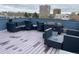 Spacious rooftop deck showcasing ample seating for entertaining with beautiful cityscape views at 336 E 1St Ave # 310, Denver, CO 80203