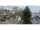 Street view featuring neighborhood houses, apartment buildings, and a tree lined street at 336 E 1St Ave # 310, Denver, CO 80203