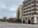 Street view of a historic building showcasing architectural details and retail spaces at 336 E 1St Ave # 310, Denver, CO 80203
