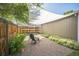 Landscaped backyard seating area with gravel and shade sail at 3968 Winona Ct, Denver, CO 80212