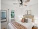 Cozy bedroom with a ceiling fan, natural light, and calming decor at 3968 Winona Ct, Denver, CO 80212