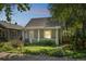 A charming home featuring a covered front porch and landscaping at 3968 Winona Ct, Denver, CO 80212