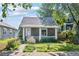 Charming home featuring a covered front porch and lovely landscaping at 3968 Winona Ct, Denver, CO 80212