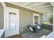 Inviting front porch with seating area and a view of the neighborhood at 3968 Winona Ct, Denver, CO 80212