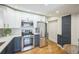 Modern kitchen with stainless steel appliances, white cabinets, and stylish countertops at 3968 Winona Ct, Denver, CO 80212