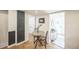 View of a kitchen nook with a round table and entryway to a hallway and another room at 3968 Winona Ct, Denver, CO 80212